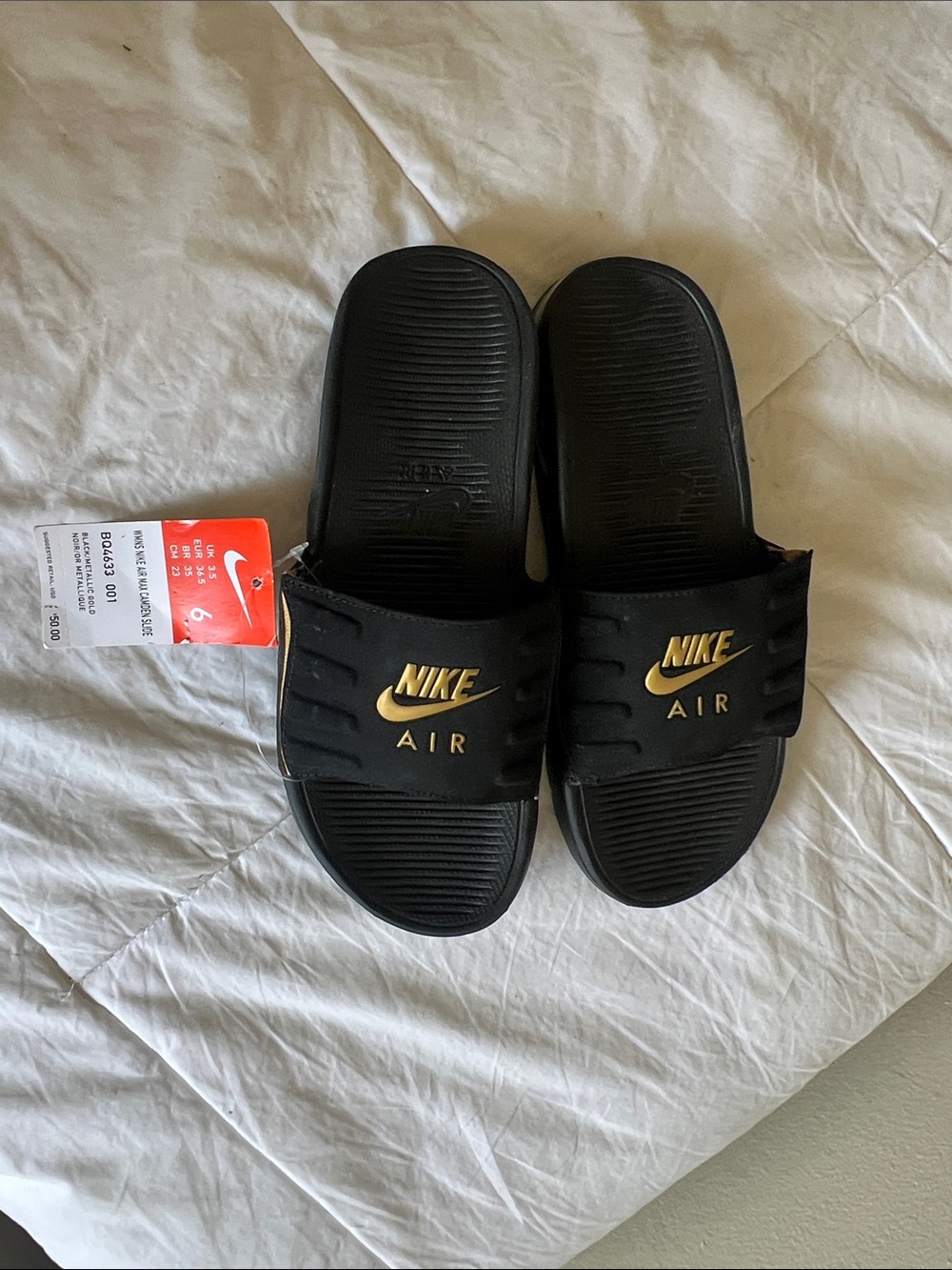 Nike Black and Gold Air Slide Sandals